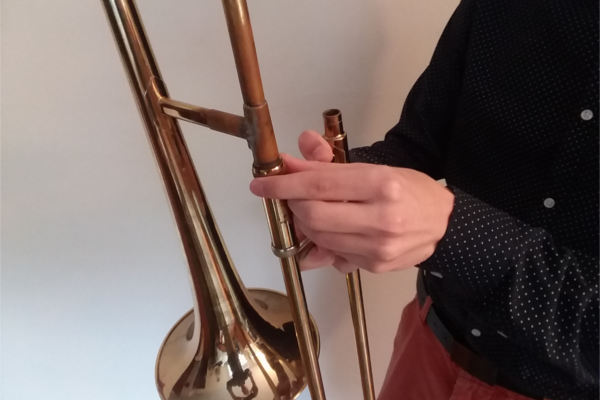trombone bell being detached from slide