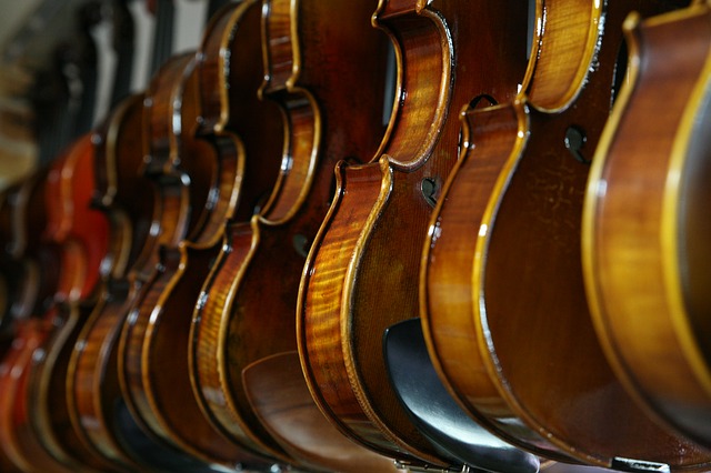 violins hanging on a wall rent band instruments
